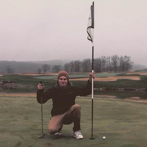 Teenage Boy Playing Golf