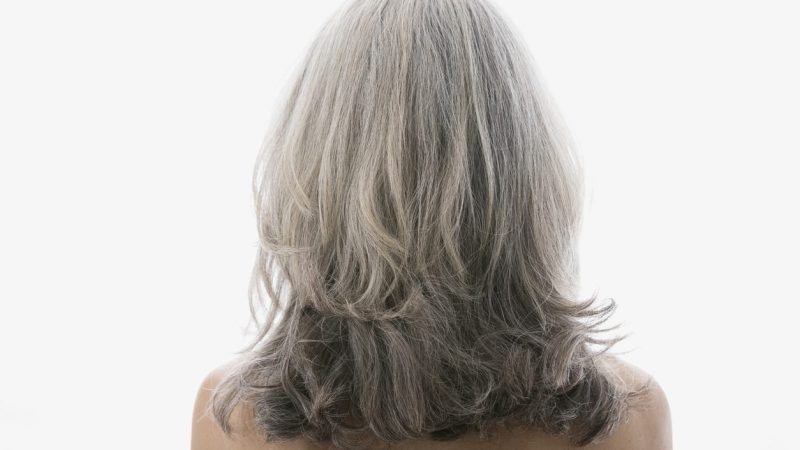 Rear view of senior woman with gray hair