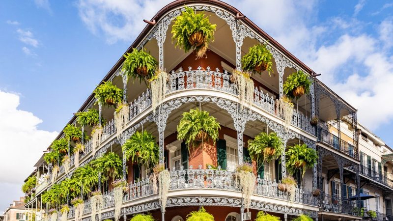 old french building with typical iron balconies in the french quarter in New Orleans, Louisiana, USA