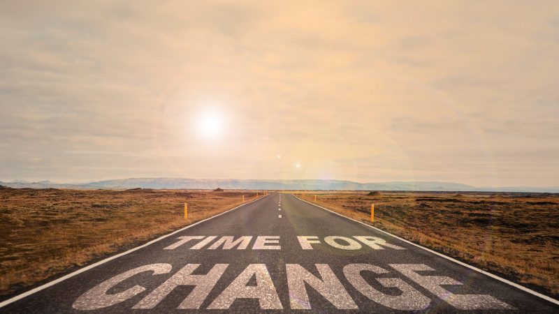 A beautiful road signifying change amidst a stunning natural backdrop. Ideal for motivational themes.